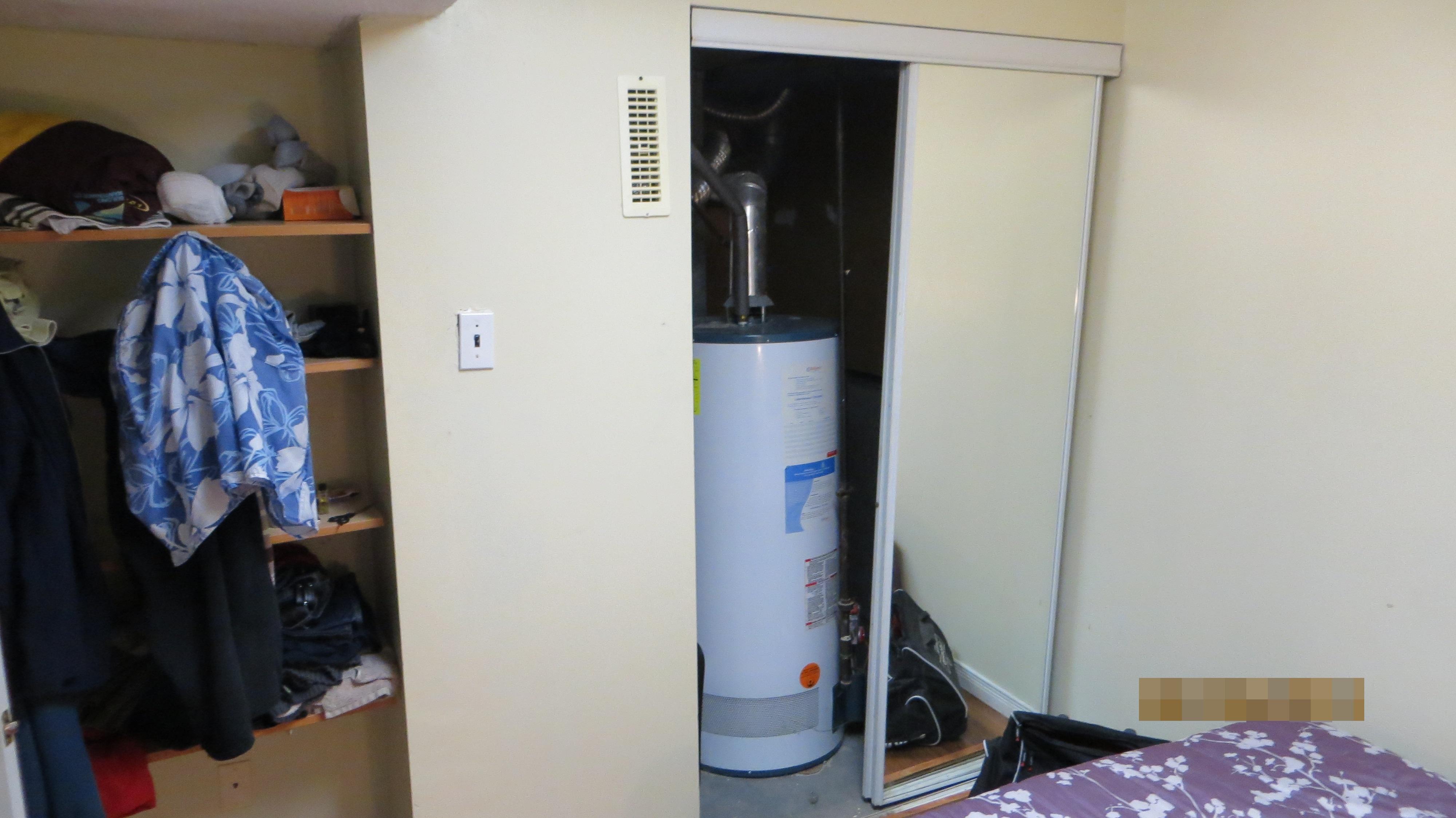 Hot water tank in bedroom closet