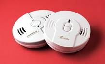 What are the locations to avoid for smoke alarms?
